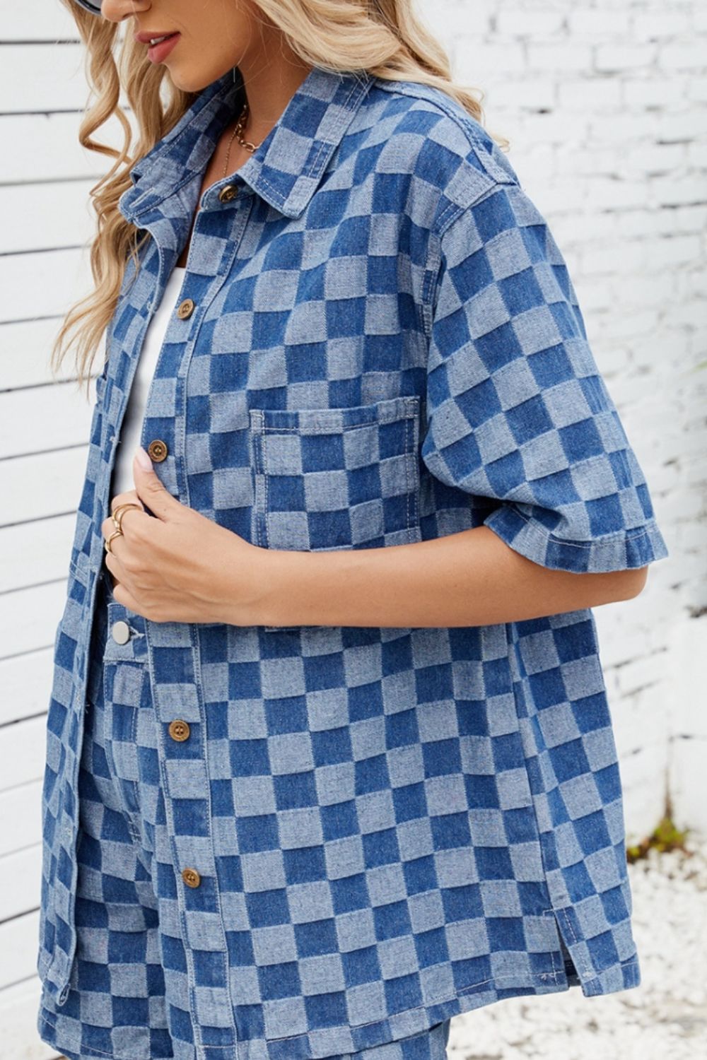 Boxy denim shirt in medium blue checkered pattern with button front and chest pocket.