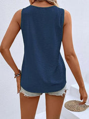Dark blue textured sleeveless V-neck top with button front detail.