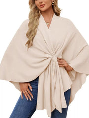 Eggshell knit cape top with tie-front and draped elegance, V-neck, wide sleeves.