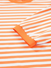 Oversized orange and white striped cotton t-shirt with 3/4 sleeves and ribbed cuffs.
