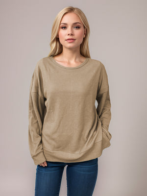 Tan waffle knit crewneck top with relaxed fit and long sleeves