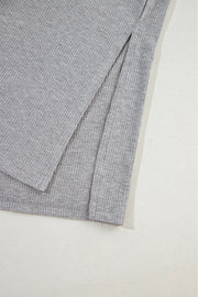 Gray ribbed knit lounge set detail showing a side slit on the garment.