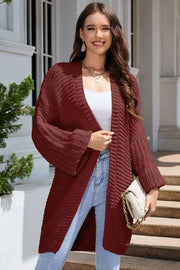 Textured knit cocoon cardigan in maroon with balloon sleeves and open front.