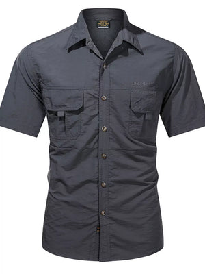 Dark gray cotton short sleeve button-up shirt with two chest pockets and a spread collar.