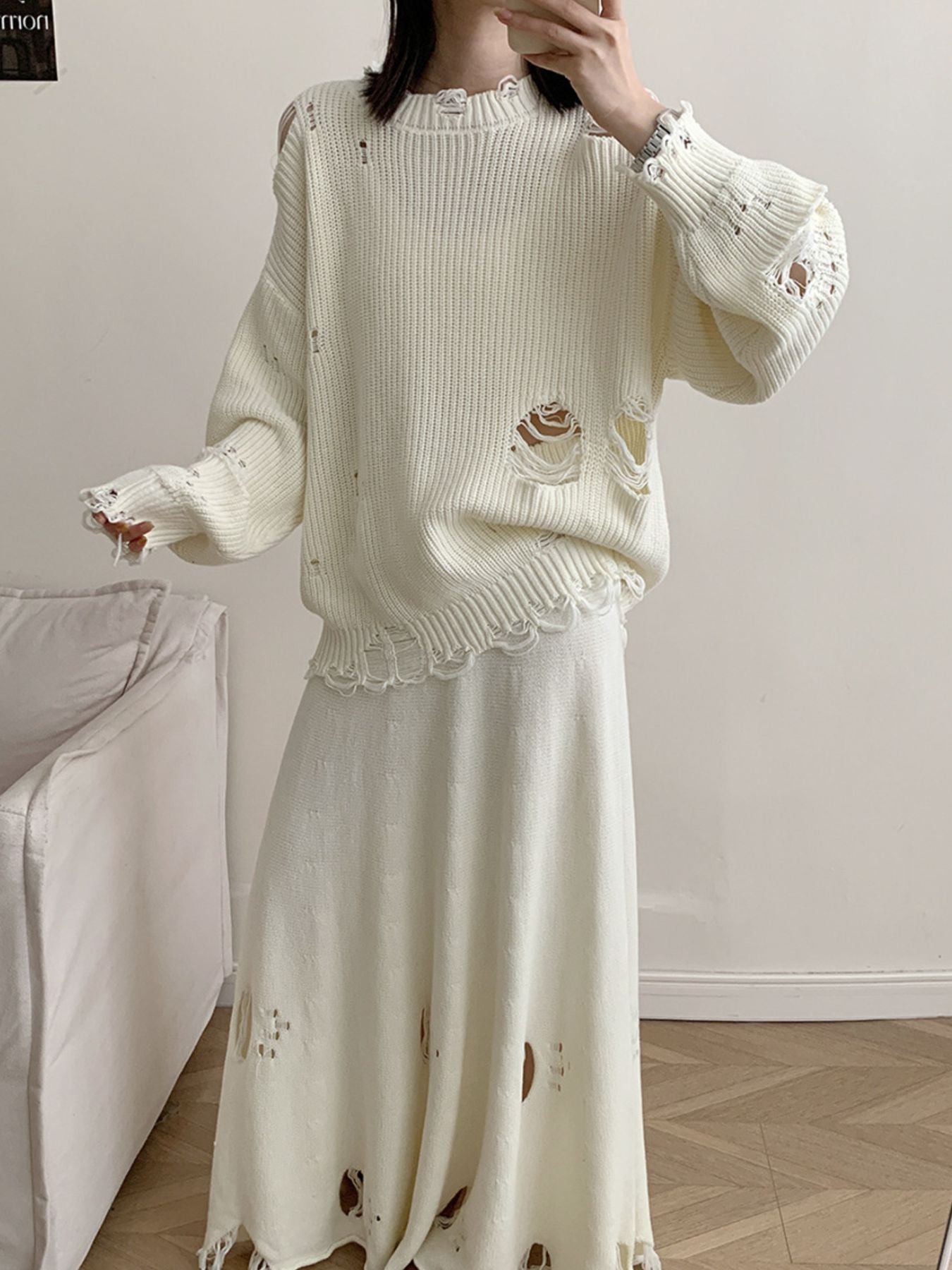 Off white distressed cotton sweater set with deconstructed details and frayed hem