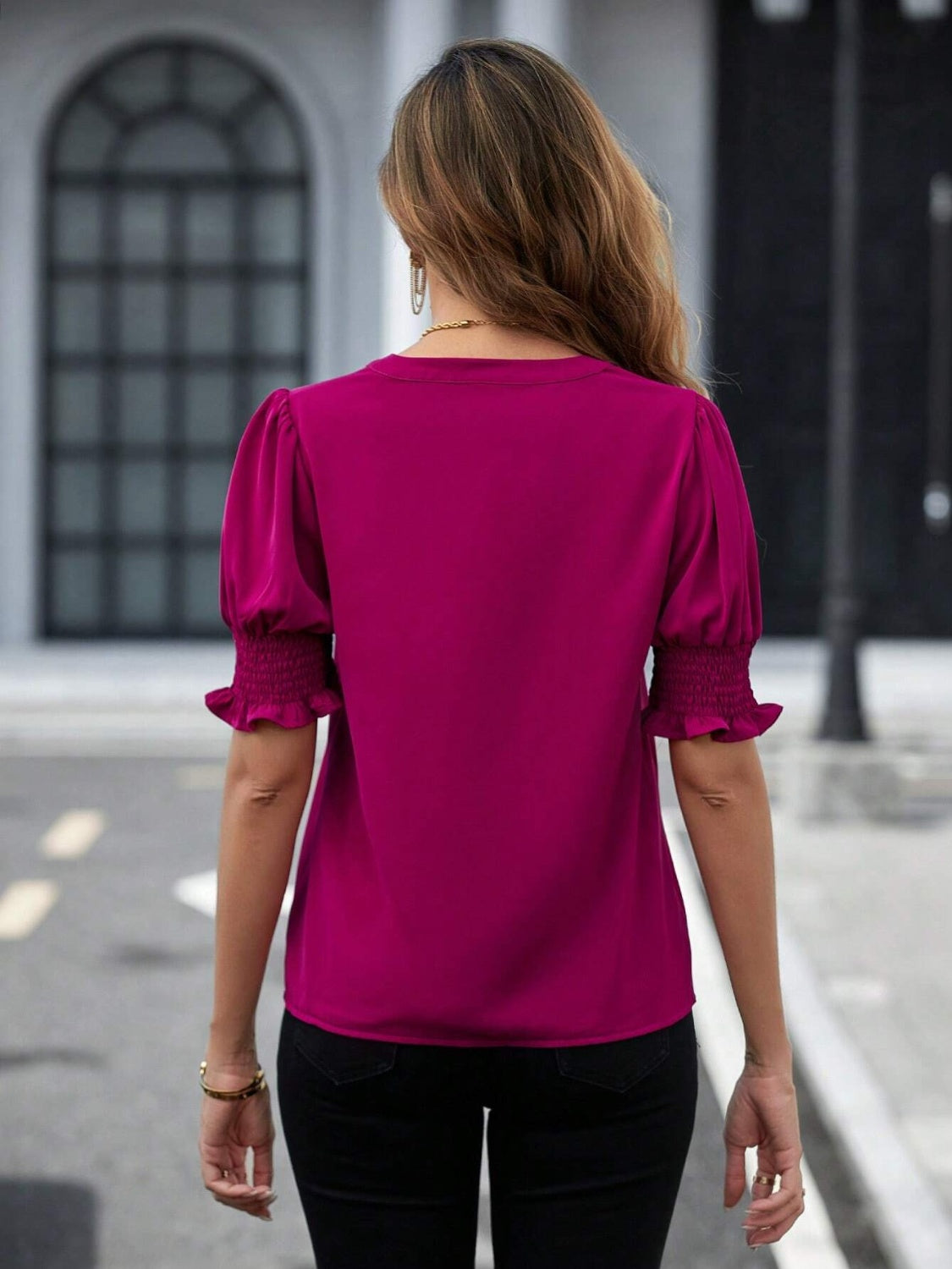 Hot Pink blouse with shirred sleeve cuffs and puff sleeves.