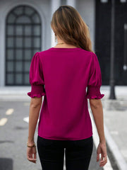Hot Pink blouse with shirred sleeve cuffs and puff sleeves.