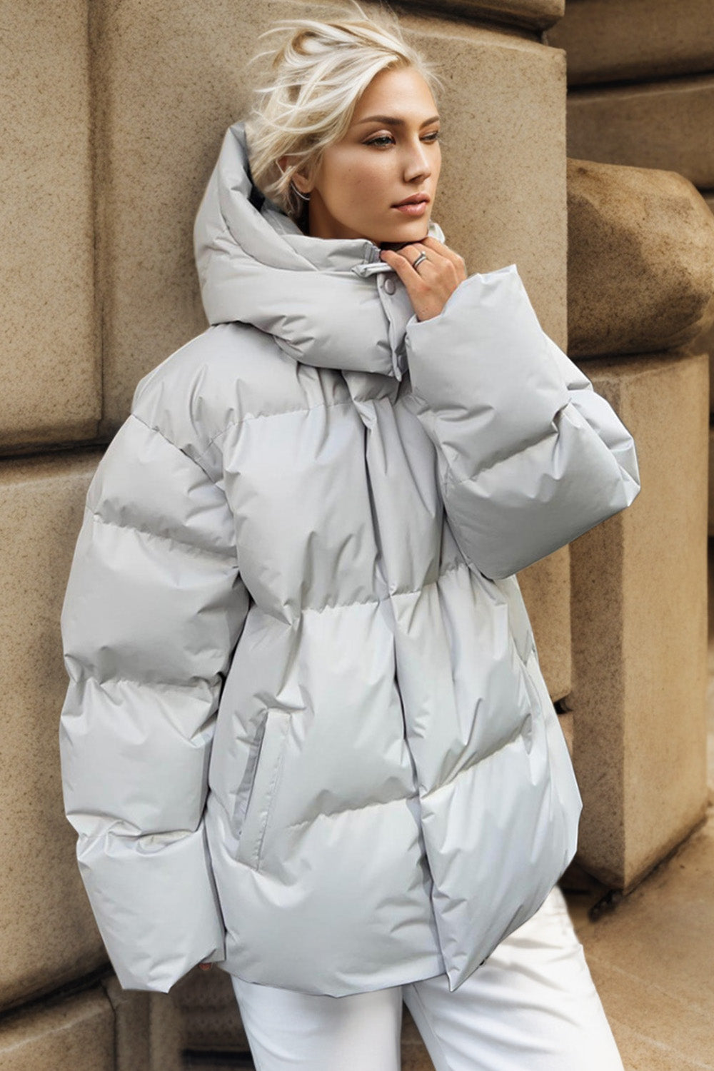 Light gray oversized puffer jacket with hood and pockets