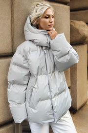 Light gray oversized puffer jacket with hood and pockets