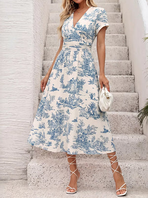 Toile print V-neck midi dress with cinched waist and short sleeves.