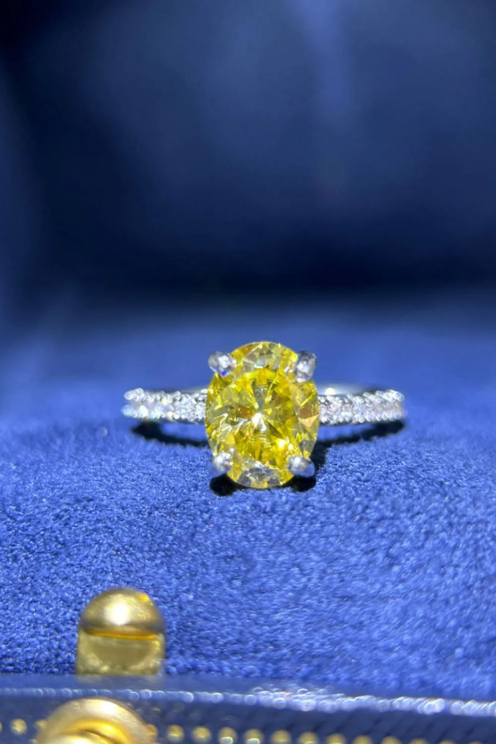 Radiant yellow oval moissanite ring with diamond band