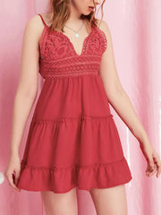 Red lace-trimmed cami mini dress with ruffle hem and tiered skirt.