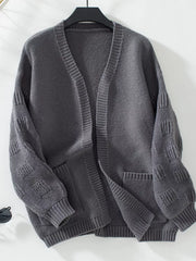 Dark gray chunky knit open-front cardigan with pockets and textured sleeves.