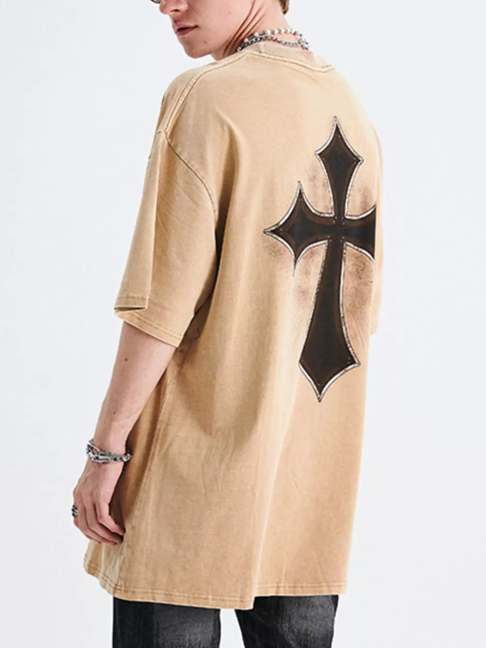 Men's tan distressed cotton graphic t-shirt with a black cross design on the back.