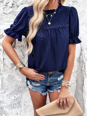 Dark Blue eyelet blouse with ruffled puff sleeves and mock neck.
