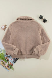 Mocha teddy bomber jacket with zip pockets and ribbed cuffs.