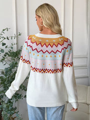 White geometric knit long-sleeve sweater with colorful fair isle pattern detail.