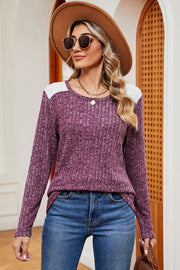 Ribbed knit top in purple with eyelet shoulder detail and crew neck.