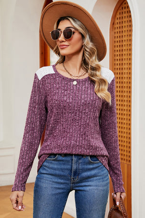 Ribbed knit top in purple with eyelet shoulder detail and crew neck.
