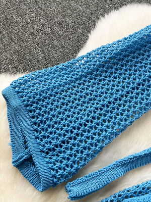Blue crochet knit tied crop top and high slit skirt set detail.