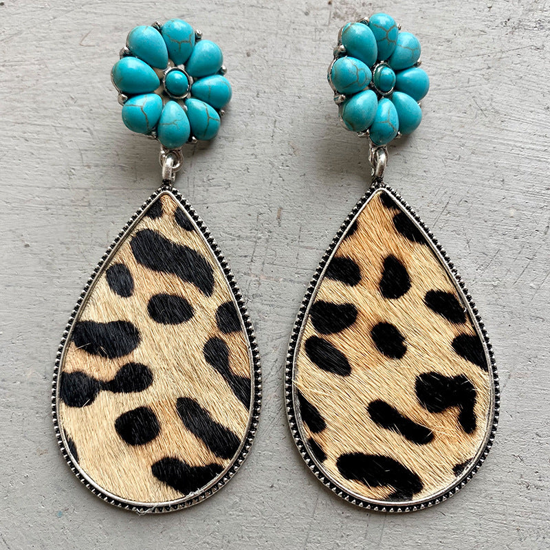 Turquoise petal earrings with leopard print hide teardrop dangles.