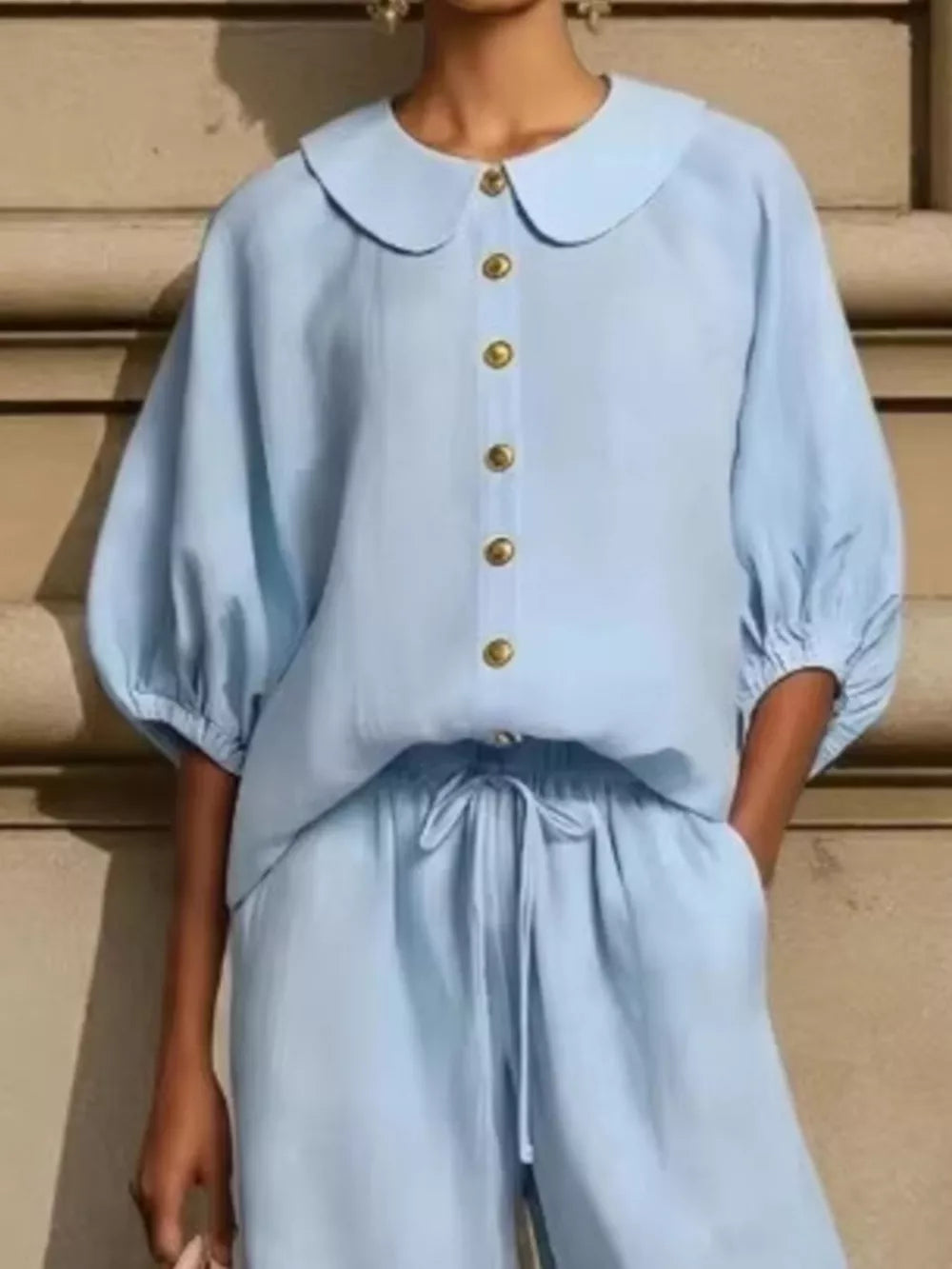 Sky blue button-down top with Peter Pan collar and drawstring pants with pockets