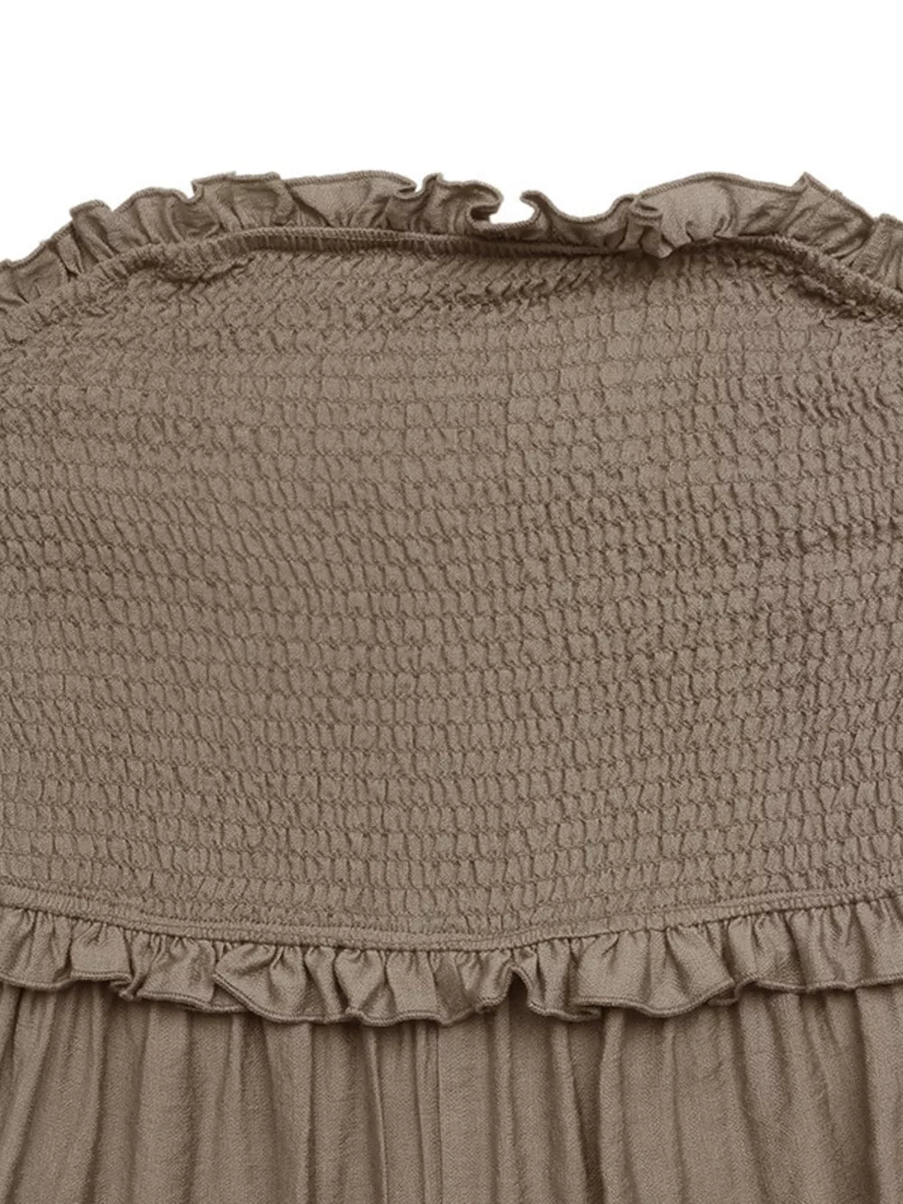 Smocked strapless romper in taupe with frill detail at neckline and hem.