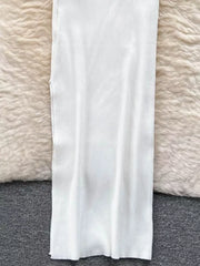 White ribbed knit midi dress with a bodycon fit and cutout detail.