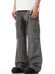 Men's grey wide-leg cargo pants with zippered pockets and a washed denim look.
