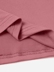 Dusty pink t-shirt detail showing hem and seam stitching