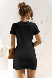 Black jersey mini dress with knot-front detail and short sleeves.