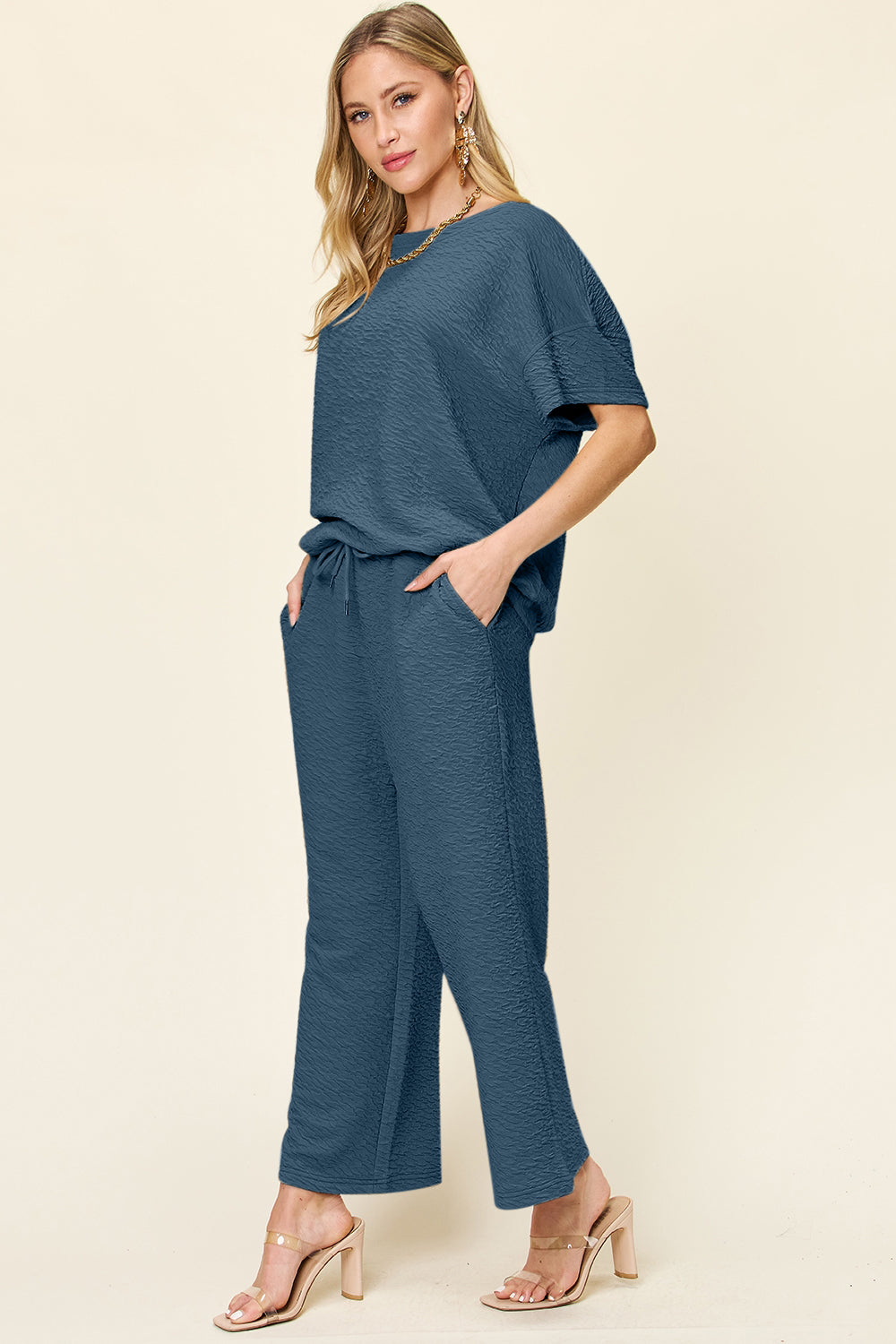 Textured cocoon top and wide leg pants set in blue, featuring a drawstring waist and pockets.