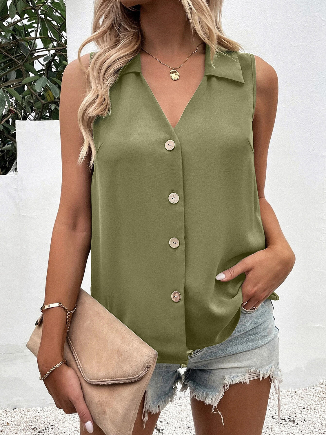 Sleeveless collared button-down blouse in olive green with a V-neck and light wood buttons.