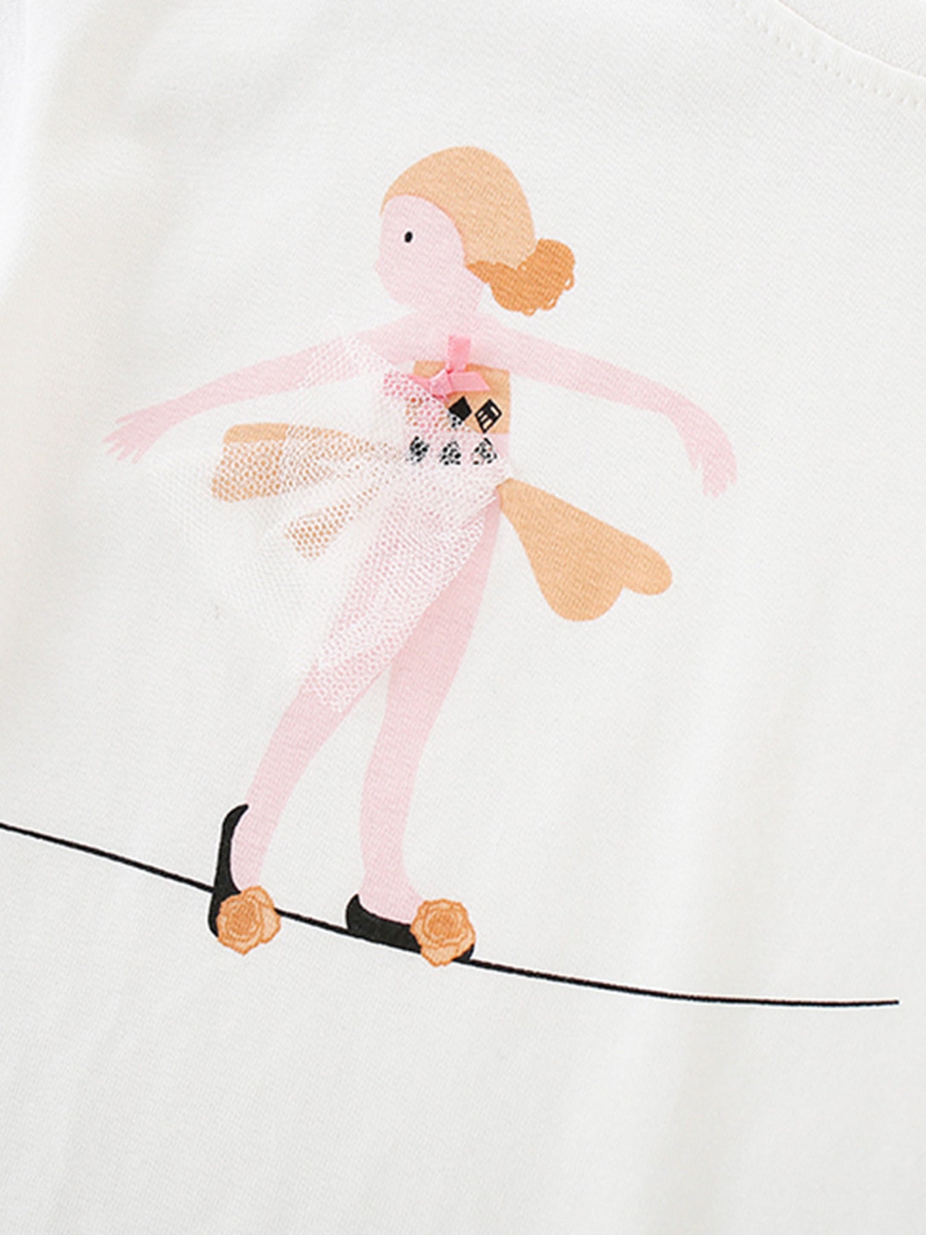 White cotton baby tee with a playful ballerina graphic on a tightrope.