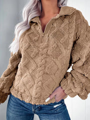 Textured fleece quarter zip sweatshirt in khaki with diamond pattern and ribbed collar.