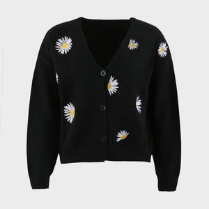 Black V-neck cardigan with allover daisy embroidery and button front.