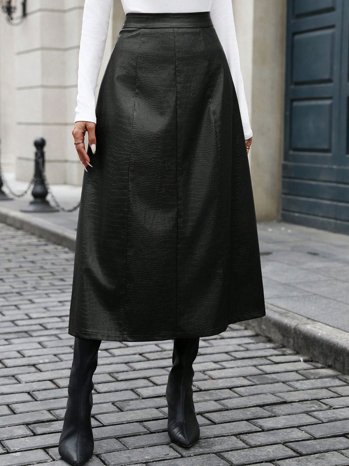 Black croc-effect A-line midi skirt with a flared silhouette.