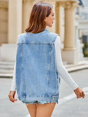 Light blue oversized denim vest with utility pockets, buttoned front, and a relaxed fit.