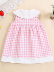 Pink gingham toddler dress with white Peter Pan collar and hem