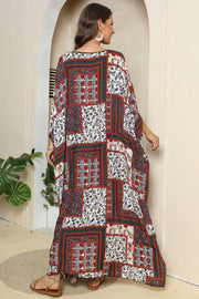 Patchwork caftan maxi dress in mixed floral prints and deep red, white, and navy.