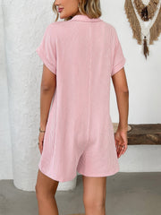 Ribbed knit romper in blush pink with short sleeves and collar.
