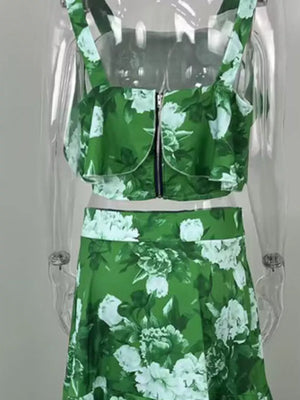 Green floral two-piece set with ruffled crop top and high-waisted skirt.