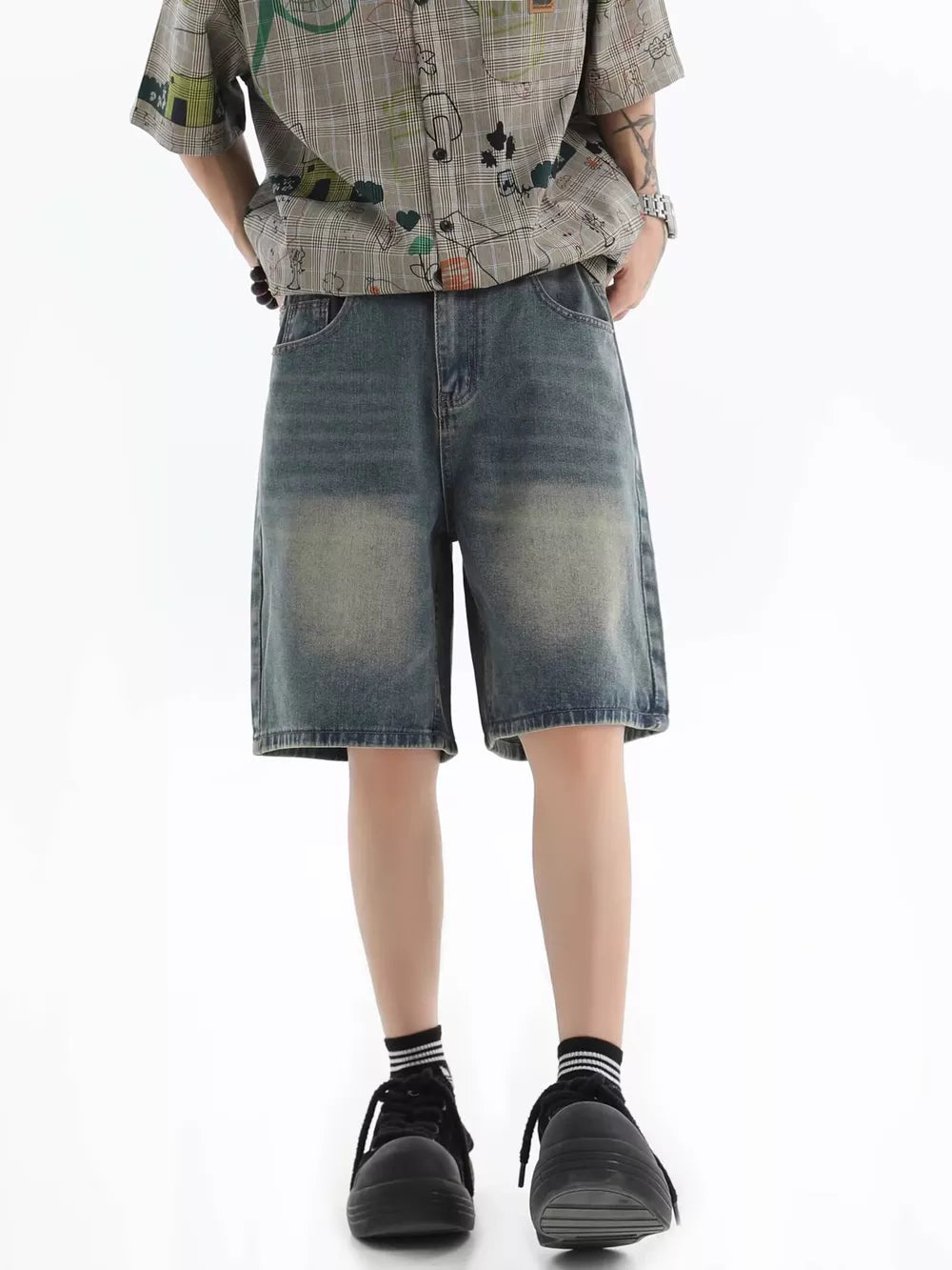 Vintage wash relaxed fit denim shorts in blue with a distressed look.