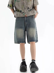 Vintage wash relaxed fit denim shorts in blue with a distressed look.