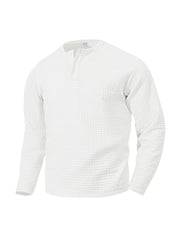 White waffle knit henley t-shirt with button placket and long sleeves.