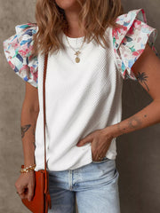 White knit top with floral ruffled sleeves and textured body