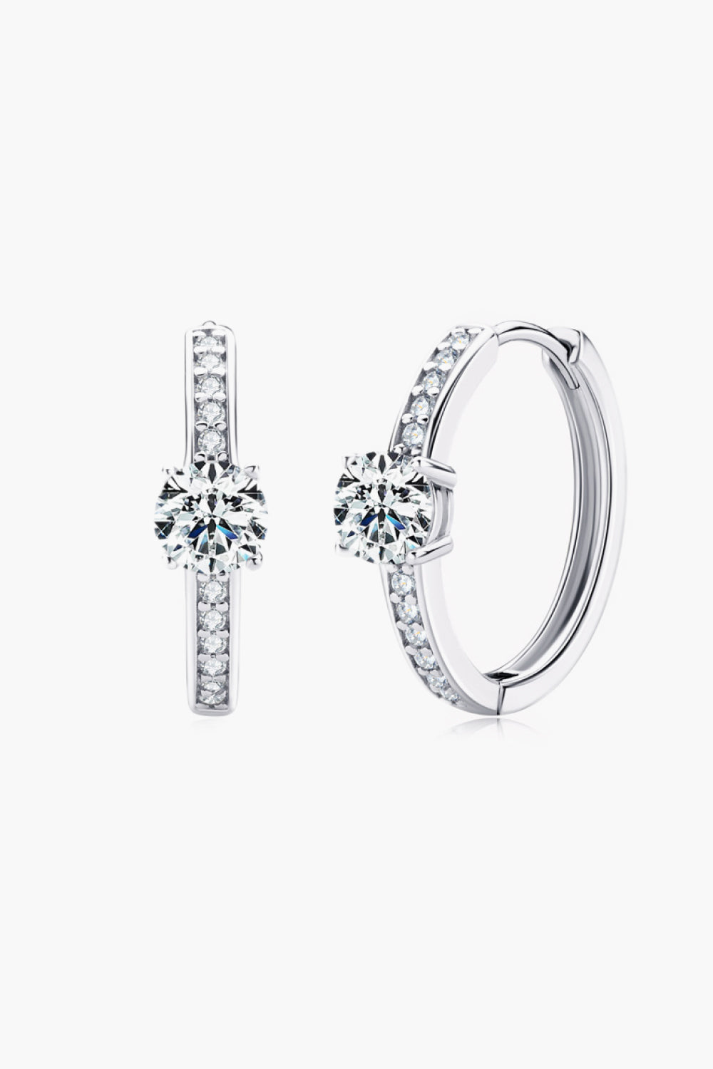 Silver pavé halo moissanite hoop earrings with a central solitaire stone.