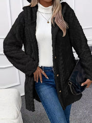 Black hooded teddy trench coat with button detail and cable knit texture.
