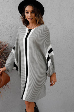 Light Gray oversized knit cocoon dress with black and white stripes on sleeves and center.