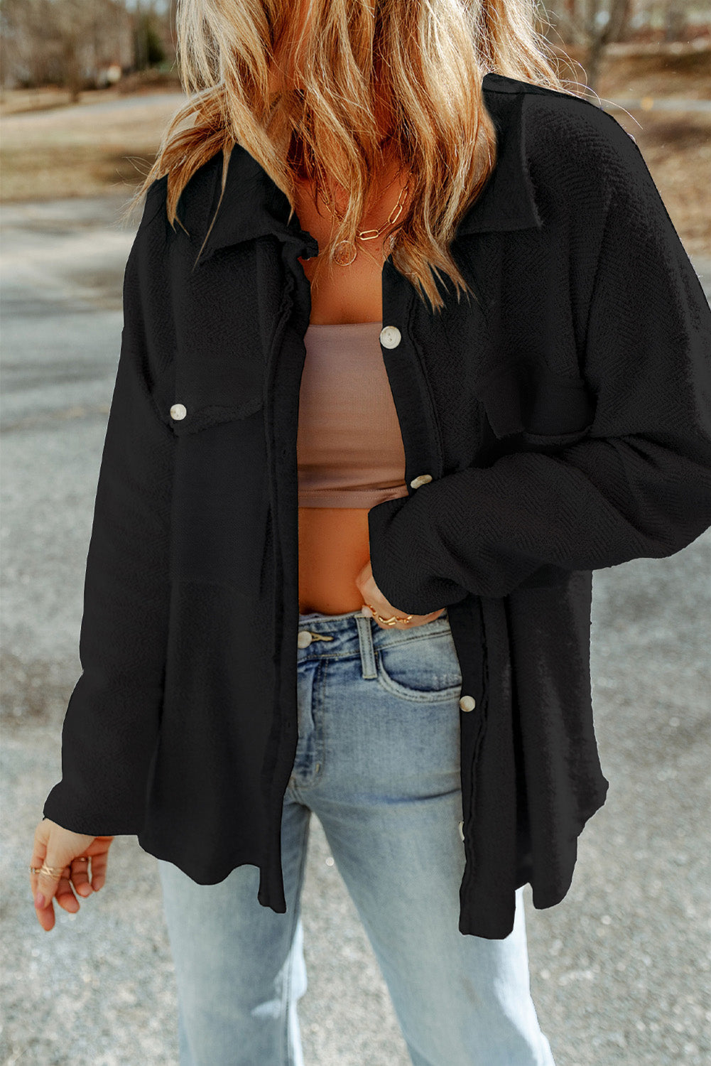 Black textured shacket with raw-edge detailing and button closure